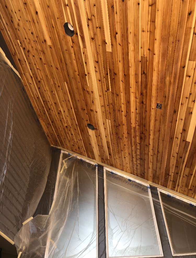 “Deck staining Salem OR – freshly stained wood deck and fence by Three Star Painting in Salem.