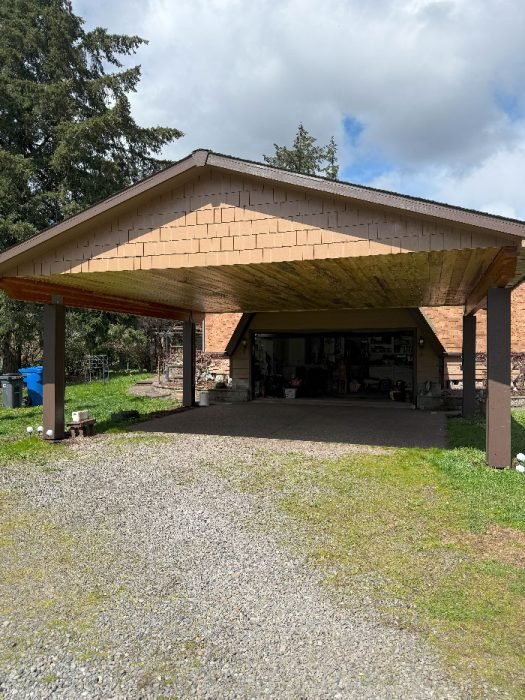 Deck staining Salem OR – freshly stained wood deck and fence by Three Star Painting in Salem.